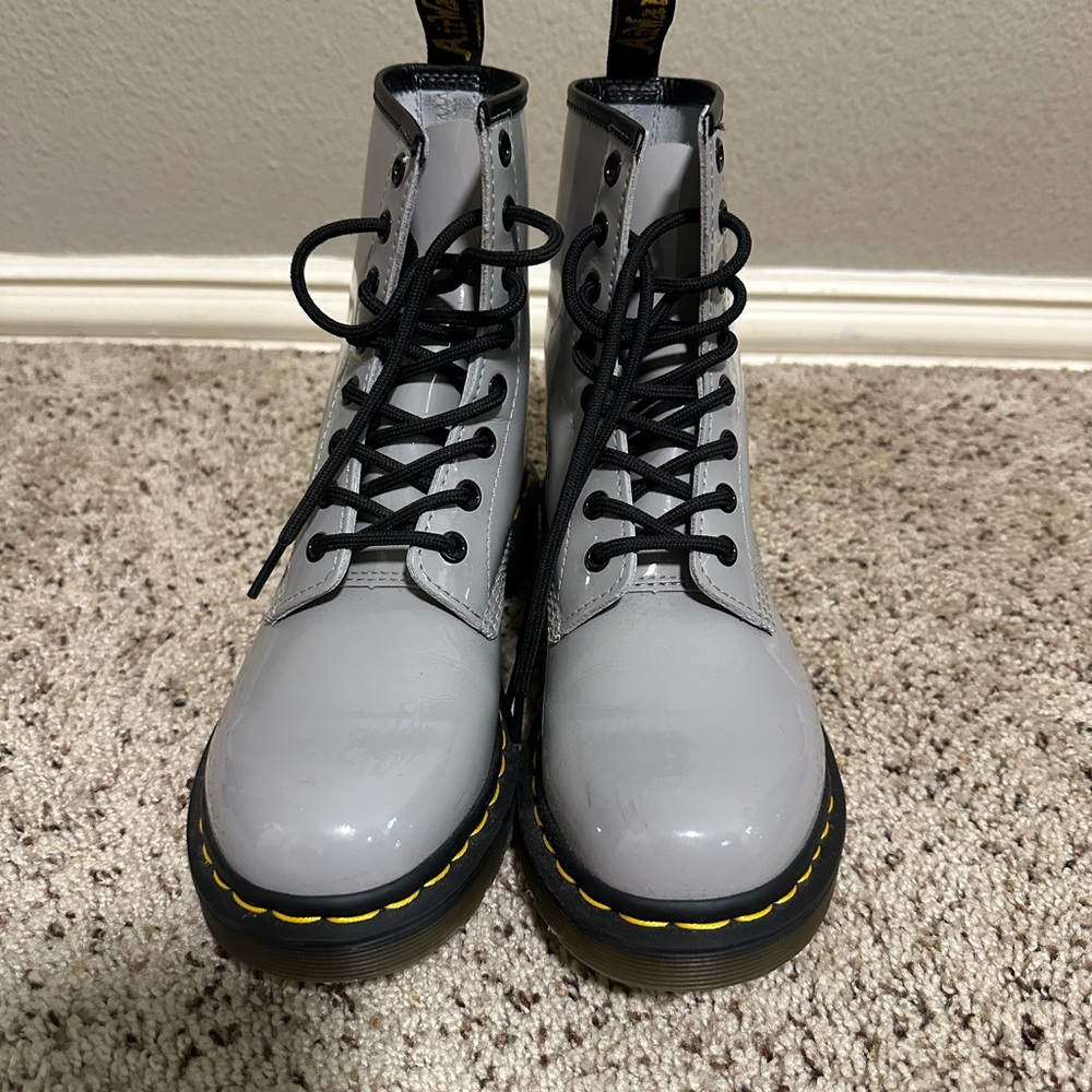 Dr. Martens women’s gray patent leather lace up boots